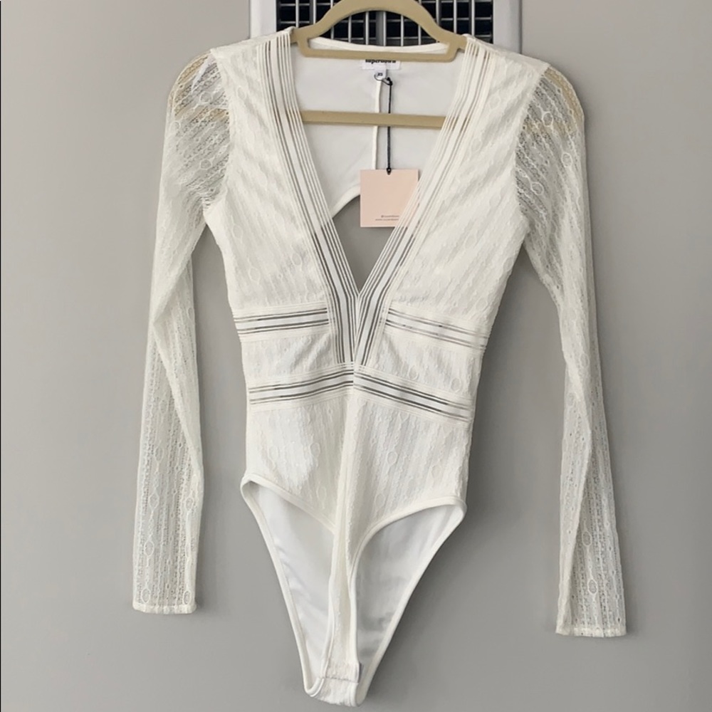 Never worn before white lace superdown body suit